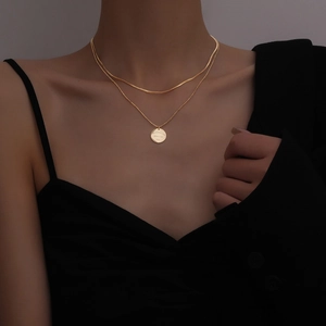 Double layer 18k gold plated necklace with round pendant and snake chain on model