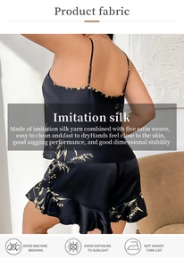 Detail view of smooth imitation silk fabric with elegant cherry print on pajama back