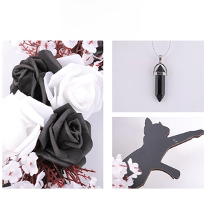 Close-up of hexagonal black gemstone pendant necklace with silver chain for Halloween