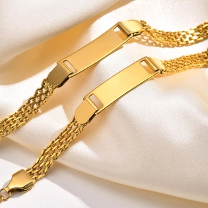 Golden 18K stainless steel mesh ID bracelet with engravable blank bar on silk