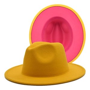 Detail of two-tone jazz hat featuring a yellow exterior and pink interior wool felt texture