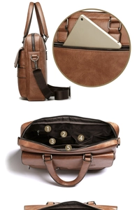 Detail view of brown business briefcase showing internal compartments and back zipper pocket