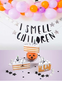 Detail of Halloween triangle cake-shaped candy boxes with bats and spider web patterns