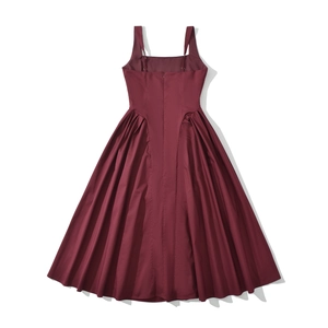 Detail of burgundy sleeveless dress featuring back invisible zipper and pleated A-line hem