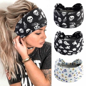 Detail showing various Halloween themed yoga headbands with skull and ghost patterns