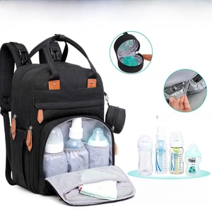 Detail of insulated pockets for baby bottles on the black multifunctional diaper backpack