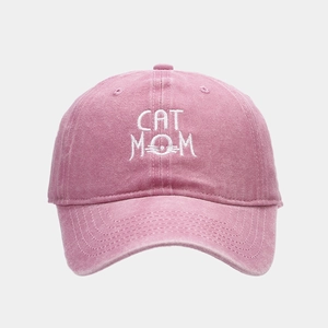 Detailed embroidery of CAT MOM text and cat whiskers on vintage washed pink baseball cap