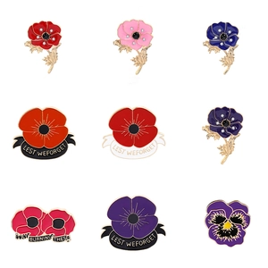 Détails de neuf broches coquelicot en émail avec des centres en cristal