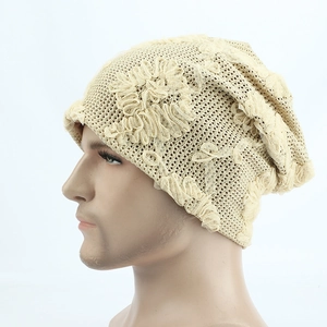 Detail of lace knit floral beanie featuring intricate hollow out flower patterns in beige