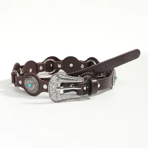 Vintage western leather belt with turquoise inlay and silver carved buckle on white background