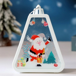 Close-up of a white Christmas lantern with Santa Claus pattern and warm LED lights