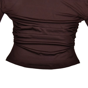 Close-up of brown long-sleeve top showing detailed back waist rushing and soft drape