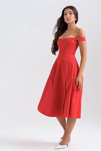 Detail view of red off-shoulder dress with waist-cinching fishbone cut and split hem