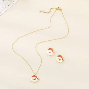 Close-up of a gold stainless steel Christmas Santa jewelry set with red enamel details