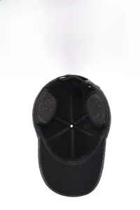 Detailed view of winter baseball cap with thick fleece lining and foldable ear flaps