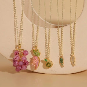 Chic gold necklaces with zircon fruit and wing pendants including grape and carrot designs