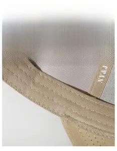 Detail of the internal widened sweatband and fine stitching on the khaki cotton baseball cap