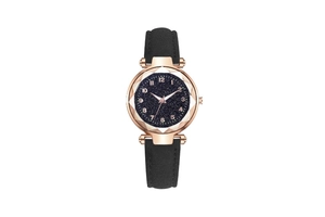 Detail of rose gold starry sky watch with faceted crystal and black suede strap