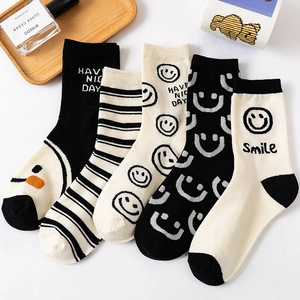 Five pack of cotton crew socks featuring minimalist smile patterns and stripes