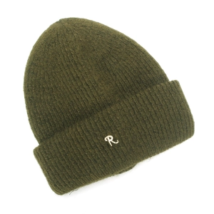 Detailed close-up of dark olive green knit beanie with white R letter embroidery