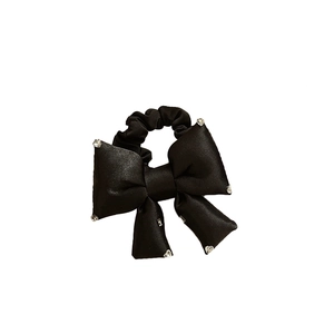 Elegant black bow hair tie with sparkling rhinestones and glossy satin-like finish