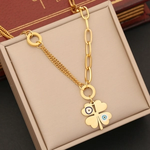 Golden stainless steel clover necklace with blue evil eye charms in a premium gift box