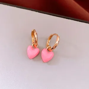 French vintage gold hoop earrings with pink enamel heart pendant in a luxury style