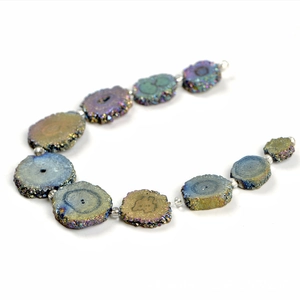 Irregular rainbow agate tower stones and silver round beads on a minimalist bracelet