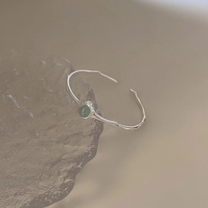 Minimalist S925 sterling silver irregular bangle with light green round gemstone