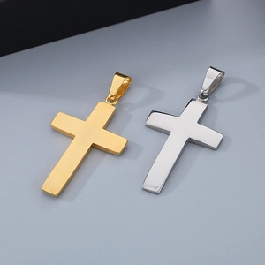 Detailed view of polished gold and silver stainless steel cross pendants for necklaces