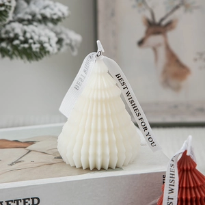 Minimalist white origami Christmas tree scented candle with decorative ribbon bow