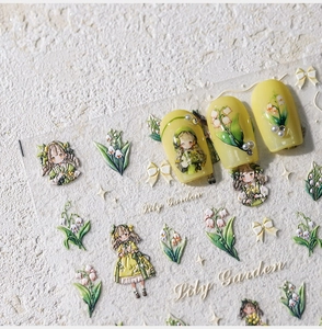 Dettaglio di adesivi nail art Lily Garden con fiori a rilievo e motivi di ragazze vintage