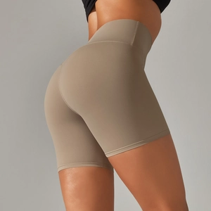 Detail view of khaki high-waisted biker shorts with seamless sculpting fabric for fitness