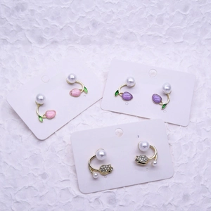 Elegant tulip pearl stud earrings with rhinestone flower details in pink and purple tones