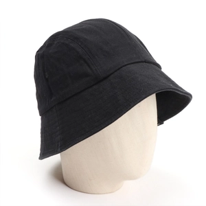 Detail view of the black canvas bucket hat fabric texture on a mannequin head
