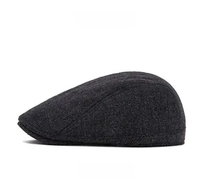 Side profile of a dark grey wool newsboy cap with retro British style and smooth lines