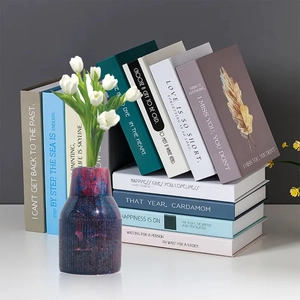 Detailed view of striped resin galaxy vase with glitter finish and white tulips