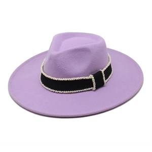 Close-up of light purple wool fedora with black ribbon and white pearl bead trim