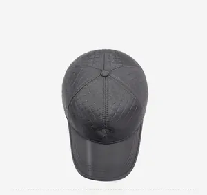 Detailed top view of dark grey winter baseball cap with quilted diamond pattern