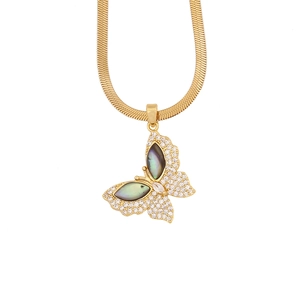 Detail of gold butterfly necklace with dark abalone shell and crystal pavé on snake chain