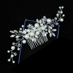 Detail of silver bridal hair comb with white faux pearls and clear crystal beads floral design