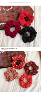 Detailed set of knit and velvet scrunchies in red and black patterns for hair styling