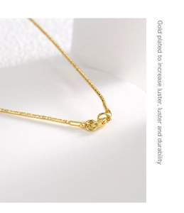 Detail of gold-plated box chain with lobster clasp and high-luster durable finish