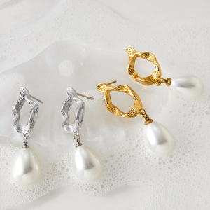 Elegant gold and silver irregular metal hoop earrings with baroque pearl pendants