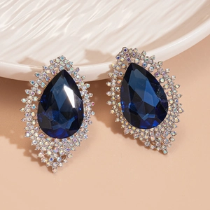 Macro shot of dark blue water-drop pendant with sparkling crystals and silver base