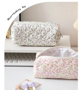 Detailed view of floral quilted stationery bag with large capacity and soft fabric