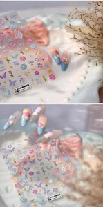 Macro detail of TS-4130 embossed 3D floral nail stickers with butterfly and flower patterns