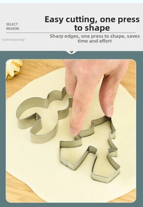 Detail of Christmas stainless steel cookie cutters in reindeer and tree shapes