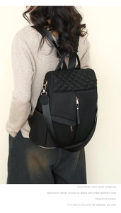 Detail of quilted nylon women backpack with diamond stitching and golden hardware