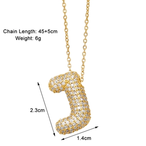 Detail view of gold letter J pendant with cubic zirconia and size dimensions info